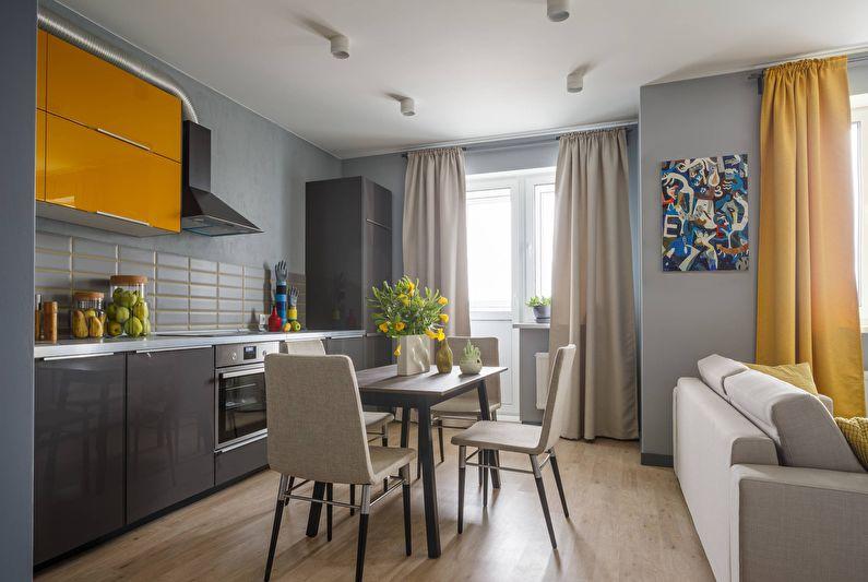 Дизайн интерьера кухни-гостиной в сером цвете - фото